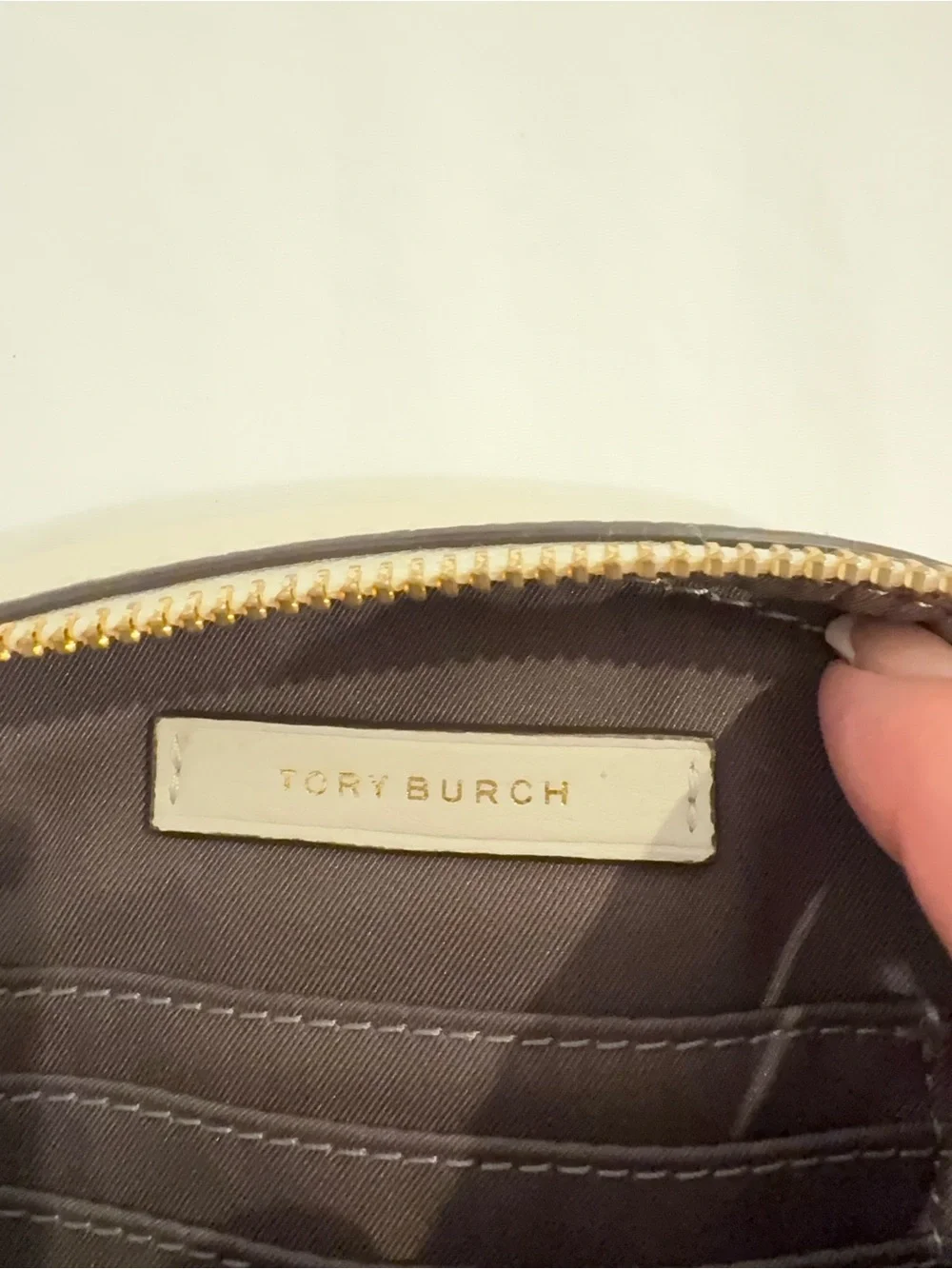 Tory Burch Pebbled Leather Crossbody in Light Cream with Tassel